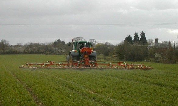 Tractor driving through a field.